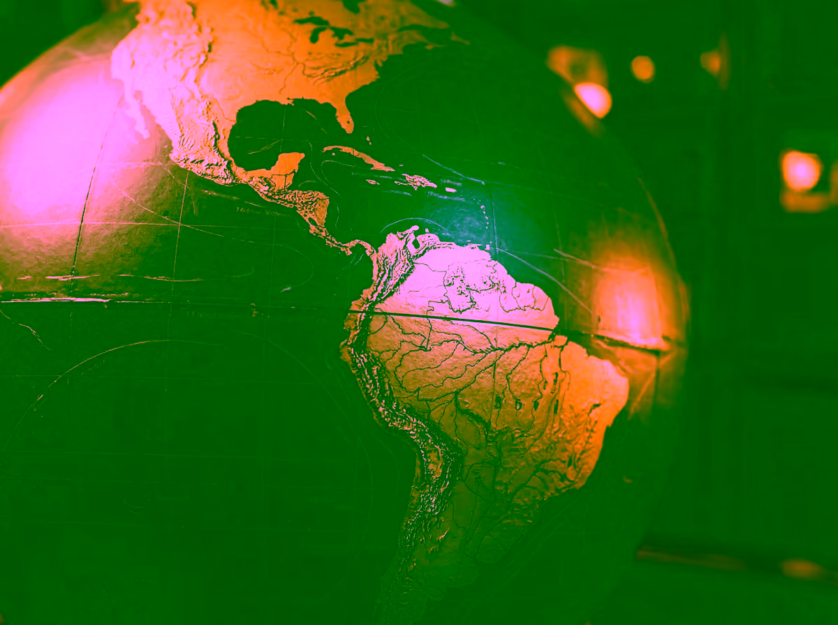 Matte terrestrial globe showing the Americas, representing GDV Holdings' multi-jurisdiction ESG framework across global markets