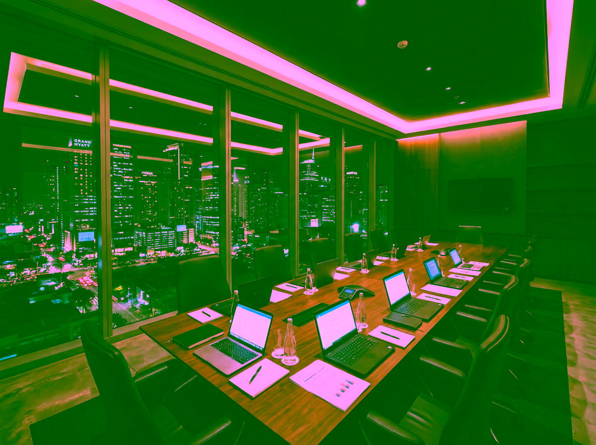 GDV Holdings boardroom overlooking Bonifacio Global City at night, representing the Group's diverse operating verticals across the Philippine financial district