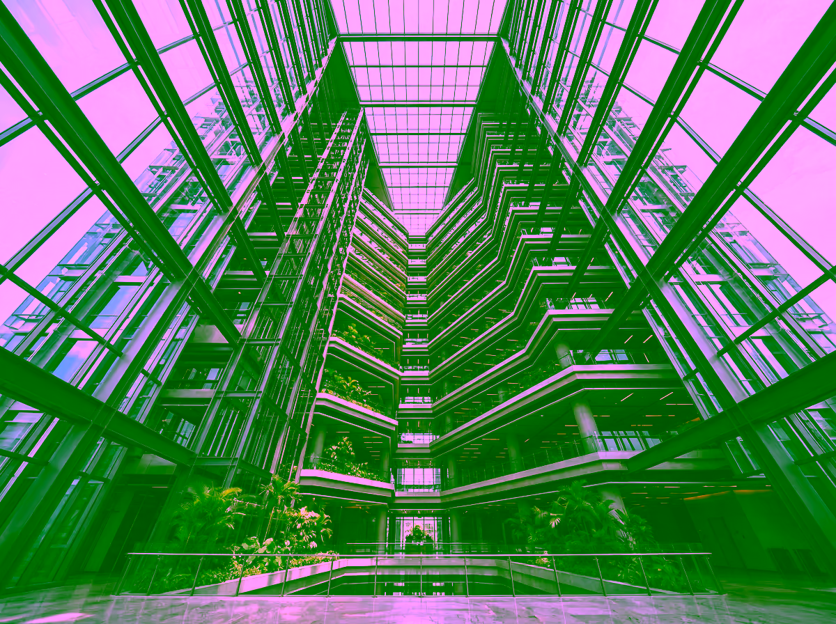 Soaring glass atrium of a contemporary Southeast Asian high-rise headquarters, representing GDV Holdings' institutional ambition and long-term operational growth trajectory