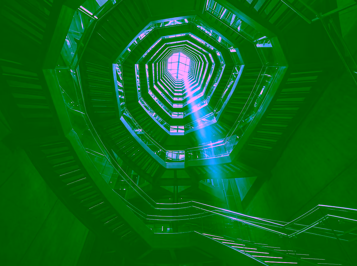 Geometric staircase viewed from below, representing GDV Holdings' structural discipline and institutional ascent