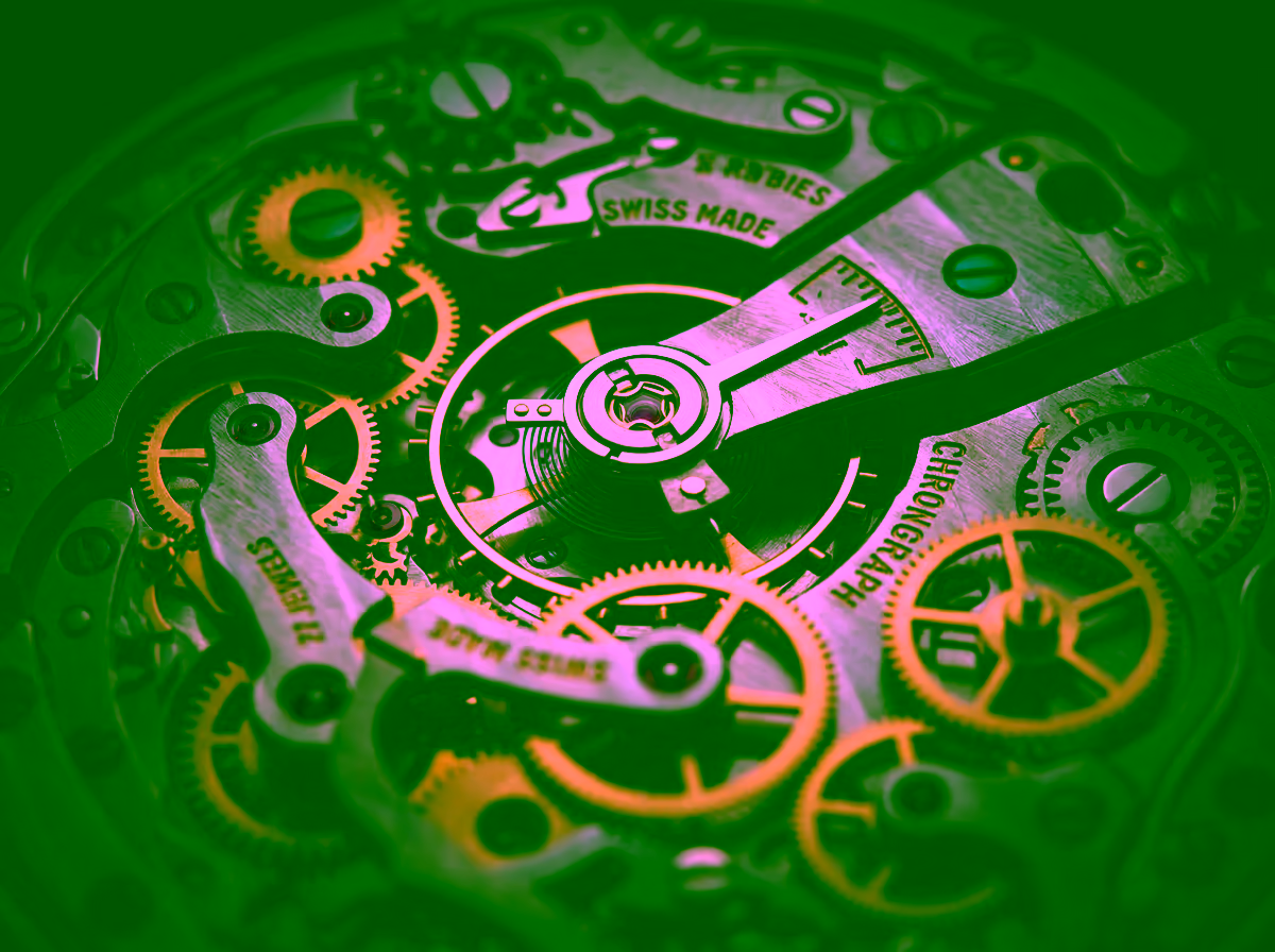 Macro close-up of a precision Swiss chronograph movement with interlocking gold and steel micro-gears, representing GDV Holdings' interlocking governance systems and synchronized risk oversight framework